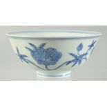 A CHINESE BLUE AND WHITE PORCELAIN BOWL, painted with flower heads, six-character mark to base, 15cm