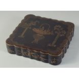 A FINE BLACK AND GILT LACQUER LIDDED BOX, containing five fitted smaller lidded boxes, each
