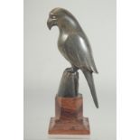 A CARVED HORN FIGURE OF A PARROT, mounted to a wooden base, 18.5cm high.