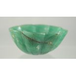 A SMALL 19TH CENTURY MUGHAL JADE / JADEITE BOWL, 7.5cm diameter.