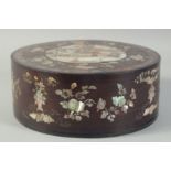 A CHINESE MOTHER OF PEARL INLAID CIRCULAR BOX AND COVER, with a central panel depicting a scene with