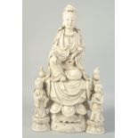 A LARGE BLANC-DE-CHINE GUANYIN AND CHILDREN, 46.5cm high.