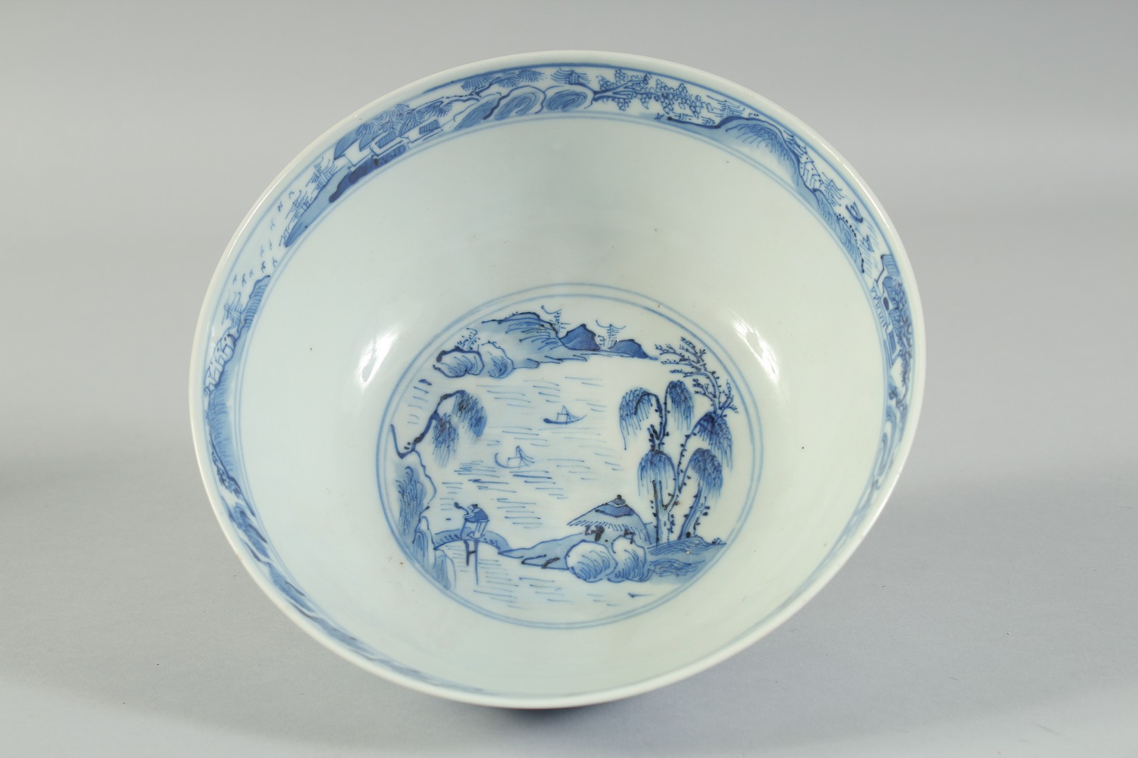 AN EARLY 20TH CENTURY CHINESE BLUE AND WHITE PORCELAIN BOWL, painted with landscape scenes, with - Image 4 of 5