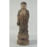 A CHINESE ARCHAIC WOOD SHAKYAMUNI BUDDHA, 56.5cm high.