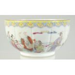 A CHINESE FAMILLE ROSE PORCELAIN BOWL, painted with a scene of various figures, six-character mark