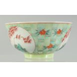 A CHINESE COPPER RED AND GREEN PORCELAIN BOWL, with bamboo and foliate decoration, character mark to