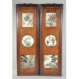 A PAIR OF CHINESE HARDWOOD PANELS INSET WITH SIX REVERSE GLASS PAINTINGS; depicting various subjects