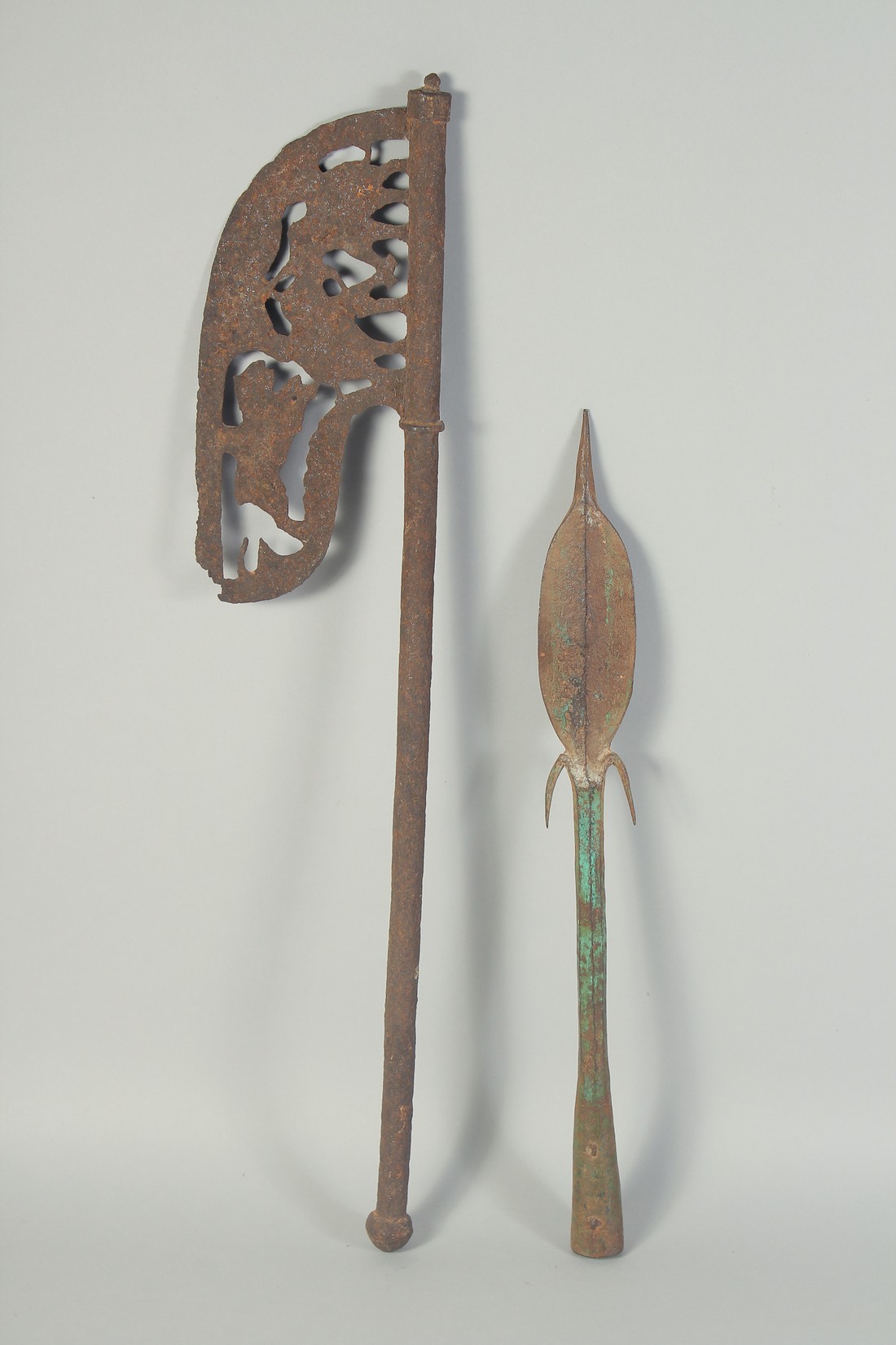 AN 18TH CENTURY INDIAN IRON AXE HEAD with openwork animal decoration, 64cm long, together with an - Image 2 of 3