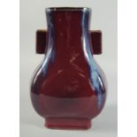 A CHINESE FLAMBE GLAZE TWIN RING HANDLE VASE, 28cm high.