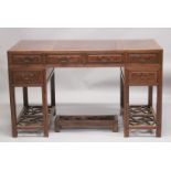 A 19TH CENTURY CHINESE HARDWOOD DESK, with burlwood top and five drawers.