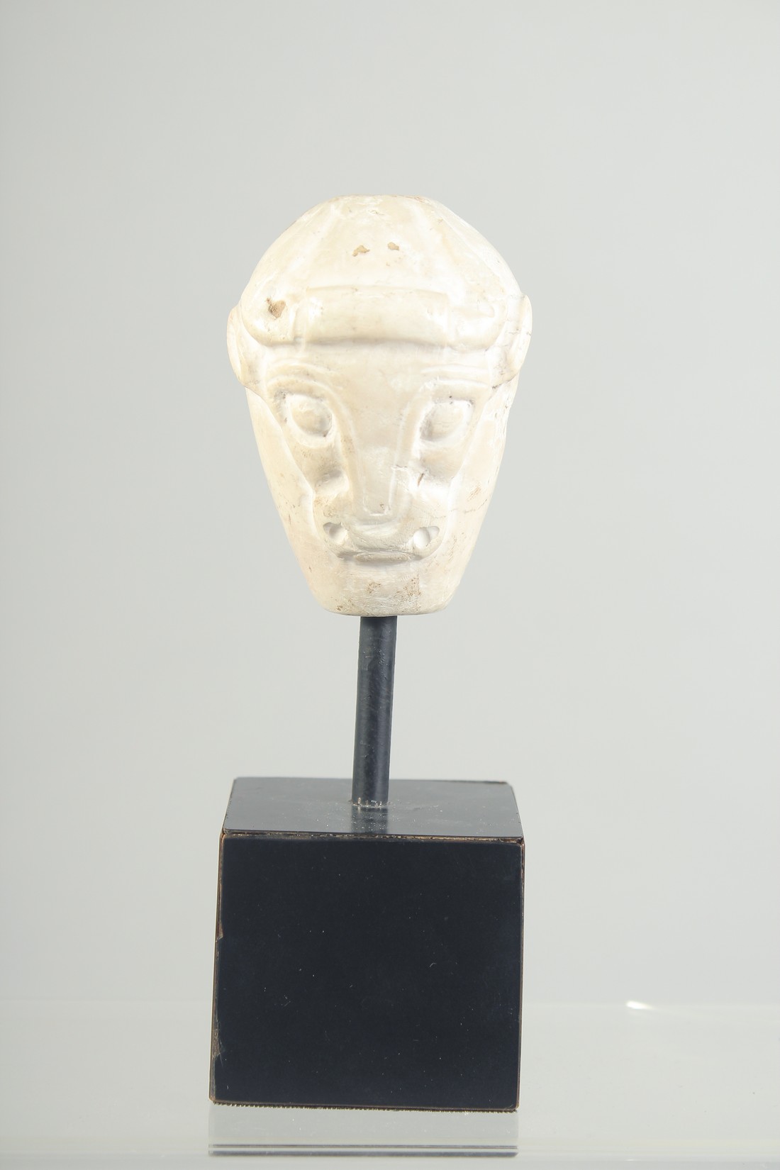 A RARE MESOPOTAMIA MASE HEAD with carved double-sided bull head, 4000 bc, raised on a purpose-made - Image 3 of 5