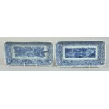 A PAIR OF CHINESE BLUE AND WHITE PORCELAIN RECTANGULAR DISHES, painted with a central panel of flora