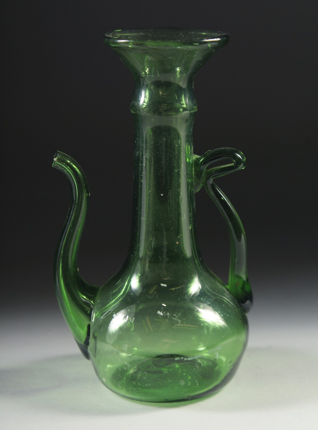 AN 18TH-19TH CENTURY PERSIAN BLOWN GLASS EWER, 16.5cm high.