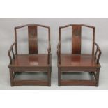 A PAIR OF CHINESE HARDWOOD CHAIRS, 61cm wide.