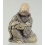 A CHINESE CARVED SOAPSTONE LUOHAN FIGURE AND STAND, the figure 8.5cm high.