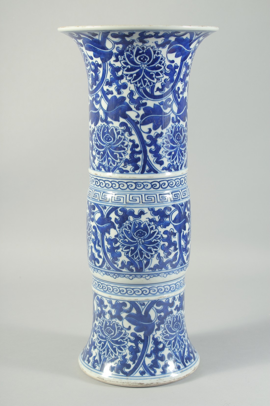 A LATE 19TH CENTURY CHINESE BLUE AND WHITE GU-FORM VASE, painted with floral motifs, 42cm high. - Image 2 of 5