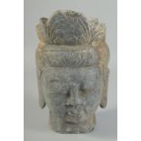 A CARVED STONE BUDDHA HEAD, 25cm x 15cm.