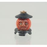 A VERY SMALL JAPANESE KOBE TOY PENDANT, with pop-out eyes, 15mm.