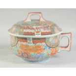 A JAPANESE KUTANI CHAMBER POT AND COVER, painted with exotic birds and flora, 26cm wide (including