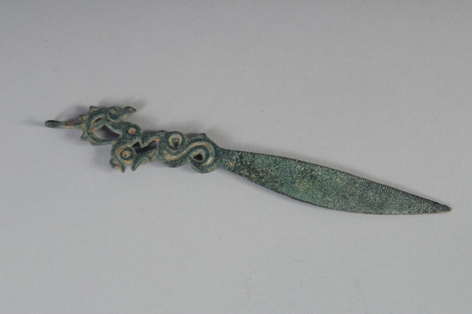 A RARE ANCIENT PERSIAN SASSANIAN BRONZE BLADE, the finial in the form of a ram, 15cm long. - Image 2 of 2