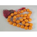 A MIXED-AMBER BEADED TASBIH.