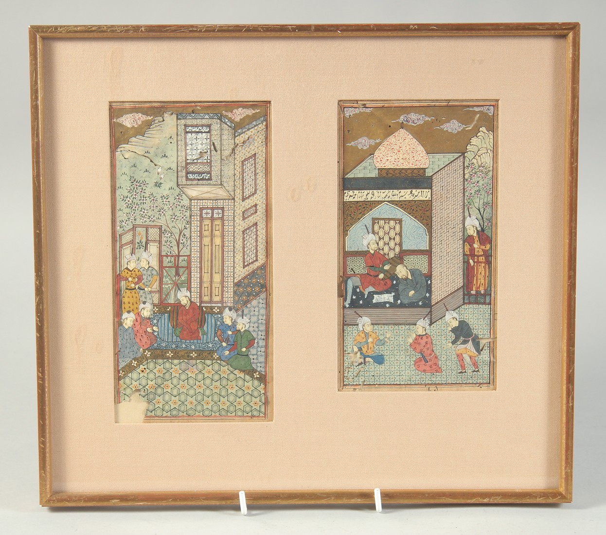 TWO FINE PERSIAN MINIATURE PAINTINGS, depicting courtyard scenes with figures, framed and glazed