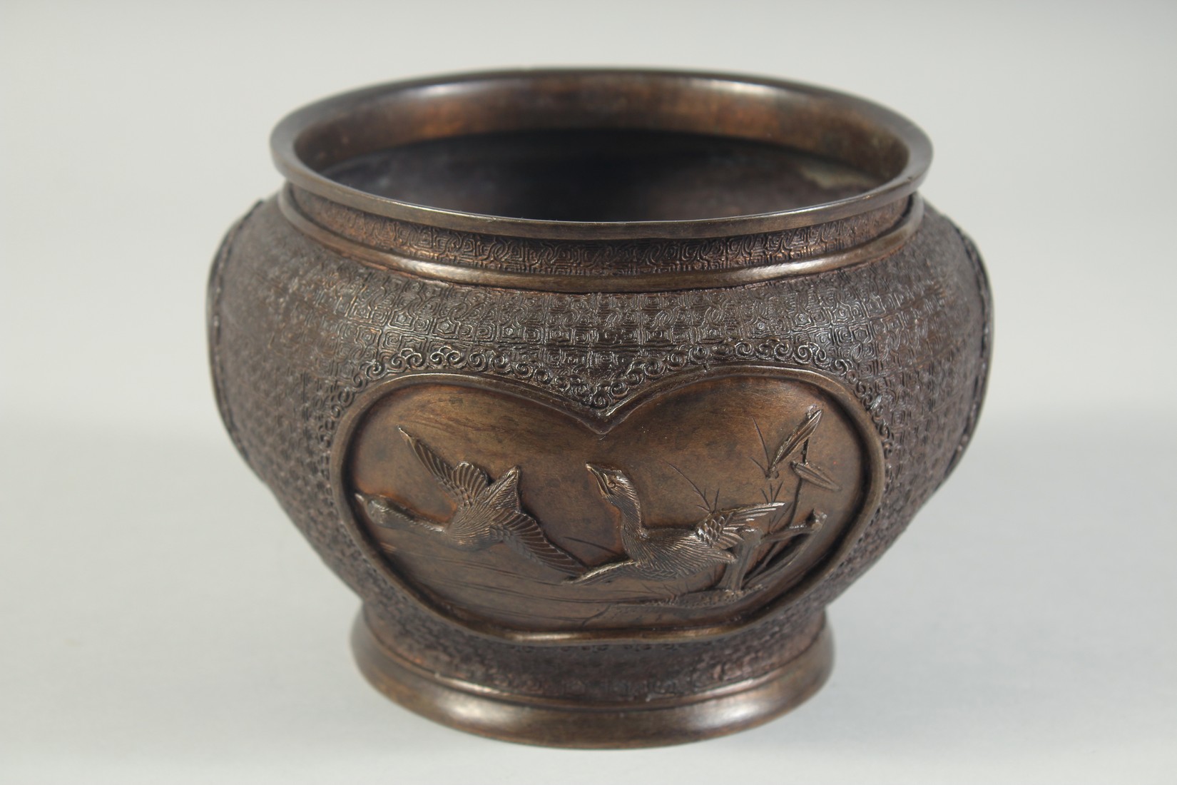 A BRONZE CACHE POT / KORO, decorated with panels of relief birds, character mark to base, 18cm - Image 3 of 7