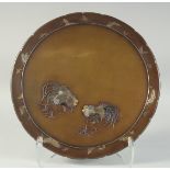 A JAPANESE MEIJI PERIOD BRONZE CHARGER; FROM THE WORKSHOP OF NOGAWA, decorated with two mixed