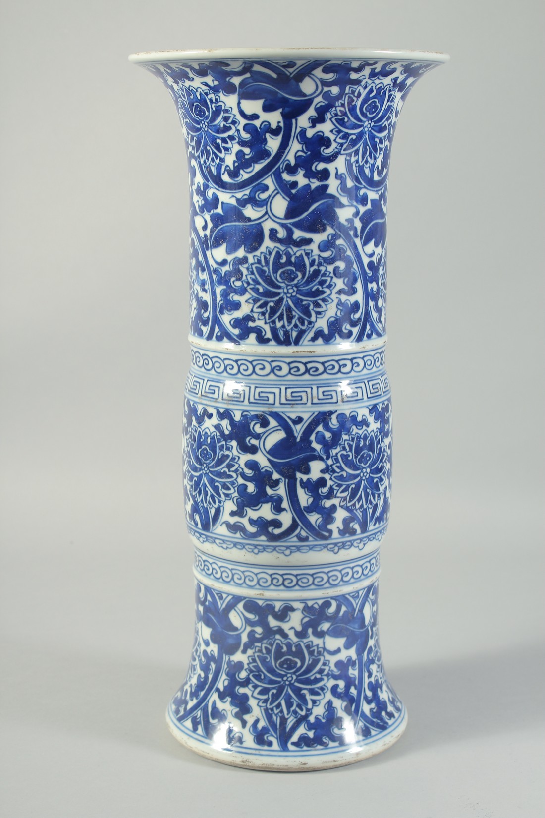 A LATE 19TH CENTURY CHINESE BLUE AND WHITE GU-FORM VASE, painted with floral motifs, 42cm high. - Image 3 of 5