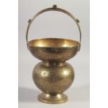 AN ENGRAVED BRASS SPITTOON, 29cm high.