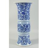 A LATE 19TH CENTURY CHINESE BLUE AND WHITE GU-FORM VASE, painted with floral motifs, 42cm high.