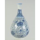 A FINE CHINESE KANGXI BLUE AND WHITE PORCELAIN BOTTLE VASE, painted with flower heads and