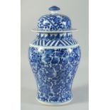 A 20TH CENTURY CHINESE BLUE AND WHITE PORCELAIN JAR AND COVER, 34cm high.