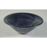 A CHINESE BLUE GLAZE POTTERY BOWL, incised character mark to base, 15cm diameter.