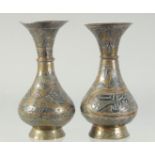 TWO SMALL 19TH CENTURY SYRIAN DAMASCUS MIXED METAL BRASS VASES, each approx. 14cm high.