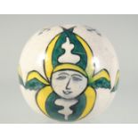 A TURKISH KUTAYHA GLAZED POTTERY HANGING BALL ORNAMENT, 11cm.