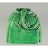 A SMALL CHINESE GREEN GLAZE INK POT.