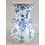 A TURKISH BLUE AND WHITE POTTERY MOSQUE LAMP, with three moulded handles and floral decoration, 35cm