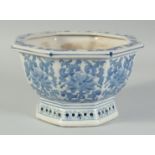 A 20TH CENTURY CHINESE OCTAGONAL BLUE AND WHITE PORCELAIN JARDINIERE, 21.5cm at widest point.