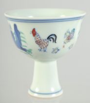 A CHINESE DOUCAI PORCELAIN CHICKEN STEM CUP, six-character mark to inner foot rim, 8.5cm high.