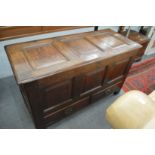 AN 18TH CENTURY OAK COFFER with a triple panel top and front with two small drawers. 3ft 8.5ins long