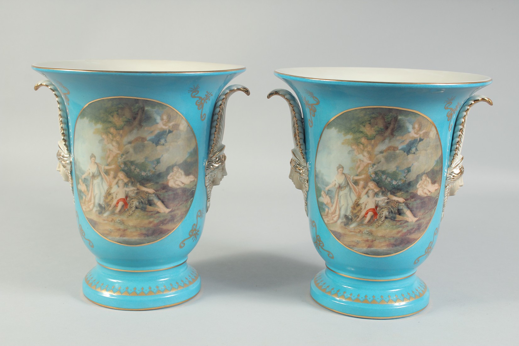 A PAIR OF SEVRES STYLE LIGHT BLUE VASES with panels of classical scenes. 10ins high. - Image 3 of 3