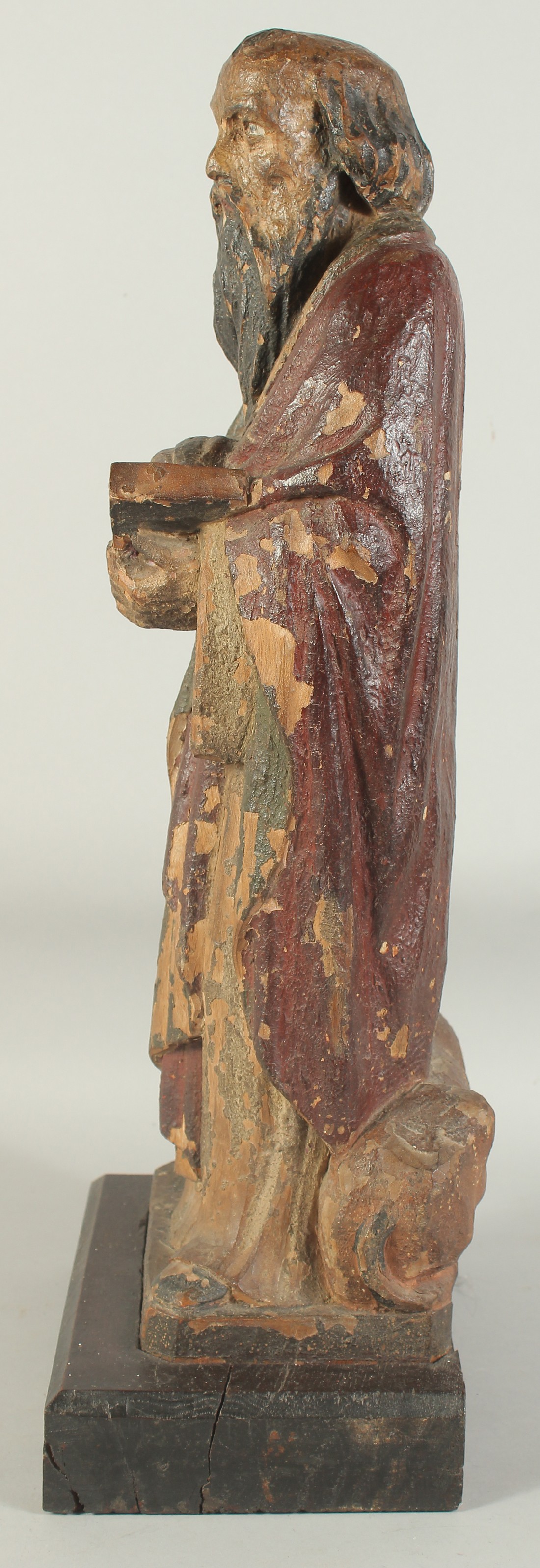 A GOOD 17TH CENTURY CARVED WOOD AND POLYCHROME FIGURE, ST. LUC, on a wooden base. 1ft 11ins high. - Image 7 of 7