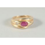 A 14CT GOLD RUBY AND DIAMOND SNAKE RING.