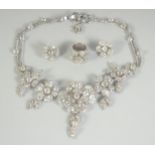 A VERY GOOD CHANEL DIAMANTE SET NECKLACE, RING AND EAR CLIPS in a Chanel box. OIA AIT125402008 COL/