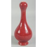 A CHINESE RED GARLIC TOP VASE. 7ins high.
