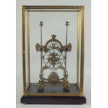 A GOOD BRASS GRASSHOPPER SKELETON CLOCK with white enamel dial, in a glass case. 19ins high