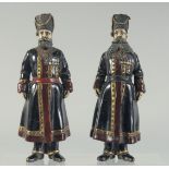 A PAIR OF RUSSIAN BRONZE GILDED FIGURES. 17cm high.