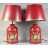 A PAIR OF RED TOLEWARE TINS as lamps with shades. Tins: 14ins high.