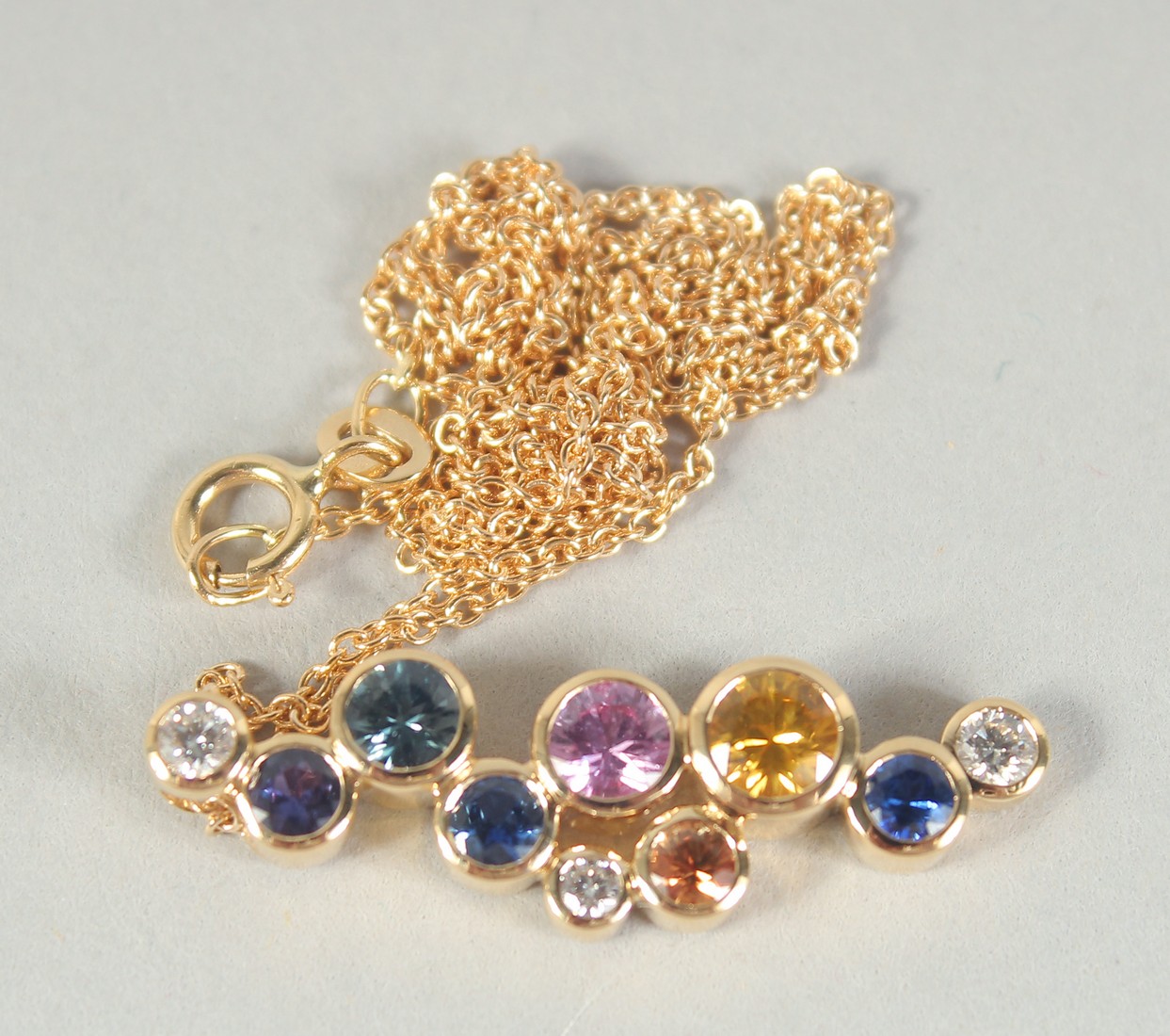 A GOOD 18CT GOLD MULTI SAPPHIRE AND DIAMOND PENDANT, one gold chain. - Image 3 of 3